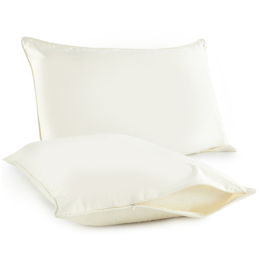 Two ivory organic cotton pillow protectors, one partially unzipped to reveal pillow inside
