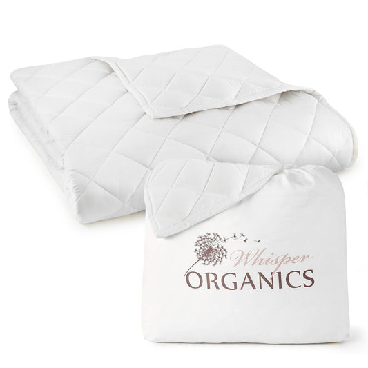 Folded white organic cotton quilted comforter with 'Whisper Organics' branded packaging on the side
