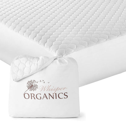White GOTS-certified organic cotton quilted mattress pad placed on bed with Whisper Organics storage bag.