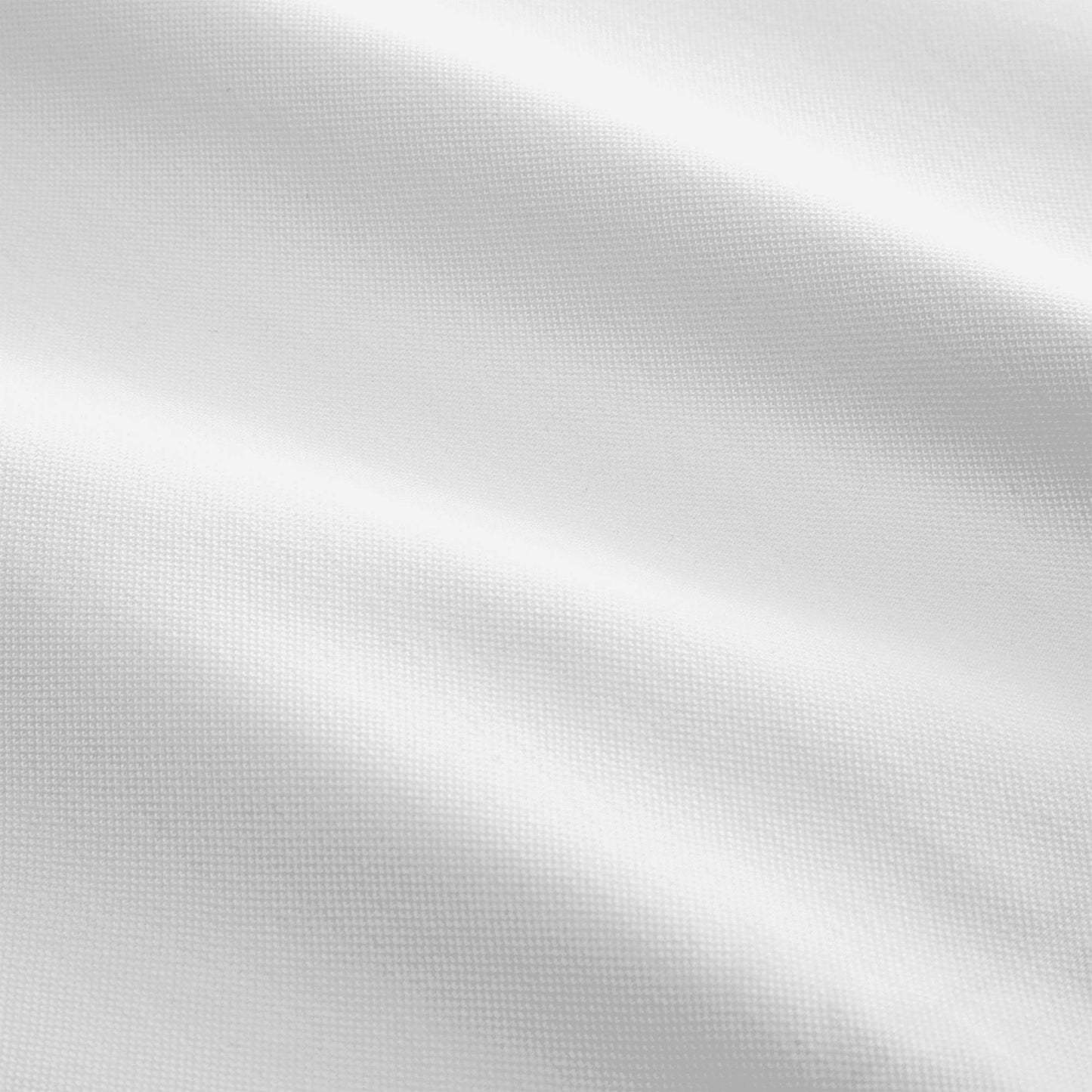 Close-up of the pique mattress cover's fabric detail.