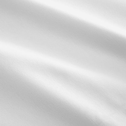 Close-up of the pique mattress cover's fabric detail.