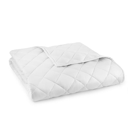 A folded whisper organics white comforter with a diamond-stitched square pattern.